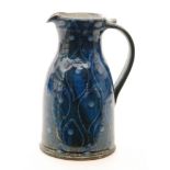 A Selbourne Pottery jug with tonal blue tear drops over a dark blue ground, impressed marks,