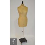 A 20th Century mannequin on square trolley base by Kennett & Lindsell Ltd,