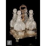 A 19th Century silver plated four bottle decanter stand the ring necked, diamond cut,