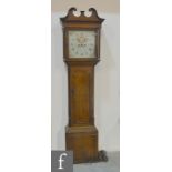 A 19th Century oak longcase clock with eight day movement striking on a bell,