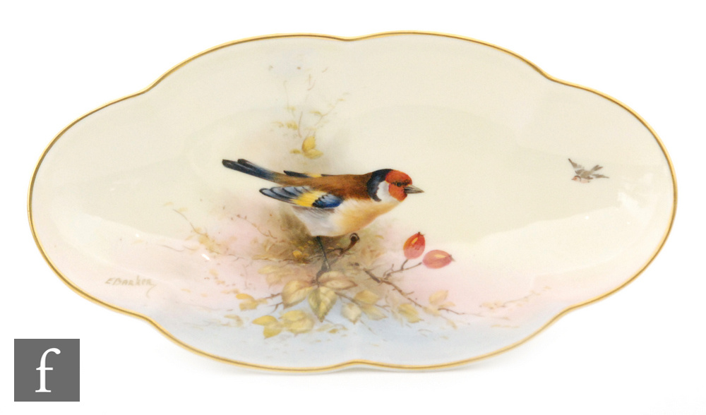 A Royal Worcester oval shaped scalloped edge dish decorated by E.