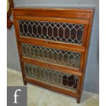 An early 20th Century three tier leaded bookcase in the manner of Globe Wernicke, height 113cm,