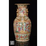A late 19th to early 20th Century Chinese famille rose export vase decorated with cartouche panels