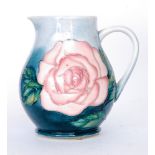 A Moorcroft Pottery jug decorated in the Rose pattern designed by Sally Tuffin - Moorcroft Pottery,