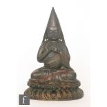 A Sino-Tibetan cast metal figure of Tsongkapa,