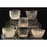 A late 19th Century clear cut crystal finger bowl of flared cylindrical form with matched stand