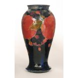 A Moorcroft vase of inverted baluster form decorated in the Pomegranate pattern with a band of