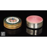 A hallmarked silver circular rouge pot with pink enamelled decoration to hinged lid, diameter 4cm,