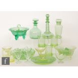 A collection of assorted uranium green glass tableware,