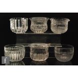 A late 18th Century clear crystal finger bowl with a heavily moulded lobed base rising to a prism