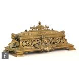 A 19th Century French brass rococo style desk stand,