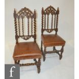 A pair of Victorian carved oak hall chairs with barleytwist frames (2)