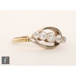 A mid 20th Century 18ct diamond five stone ring, graduated millgrain set stones to a slight twist,