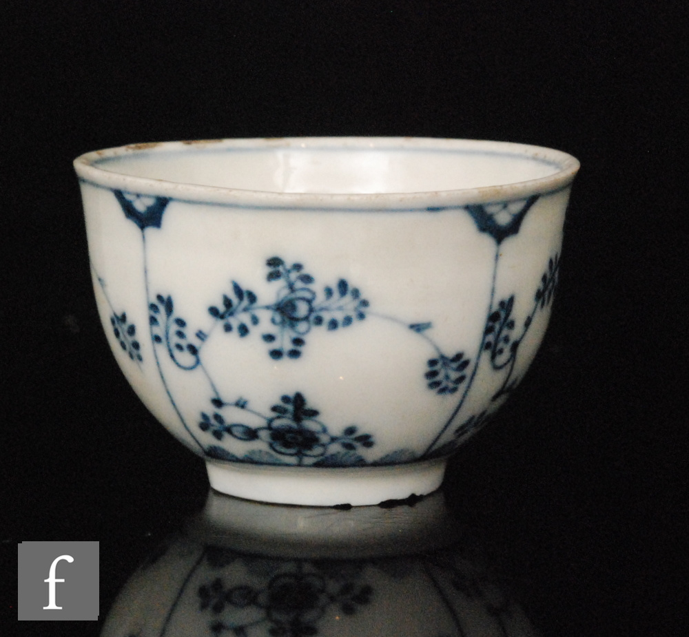 A Meissen Onion pattern blue and white teabowl decorated in an underglaze blue and white,