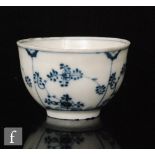 A Meissen Onion pattern blue and white teabowl decorated in an underglaze blue and white,