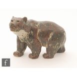 A Royal Copenhagen stoneware model of a prowling bear glazed in tonal brown and grey,