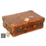 A stitched leather suitcase stamped Churchill below a crown with fitted divisioned interior,