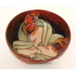 A small Moorcroft Pottery footed bowl decorated in the Red Tulip pattern designed by Sally Tuffin,