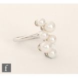 An 18ct white gold cultured pearl ring set with six vertically set stones, ring size M 1/2.