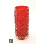 A later 20th Century Geoffrey Baxter for Whitefriars Textured range Bark vase in ruby, height 18.