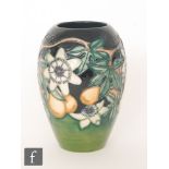 A Moorcroft Pottery vase decorated in the Passion Fruit pattern designed by Rachel Bishop,