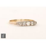 A mid 20th Century 18ct diamond five stone ring, claw set, old cut stones to plain shoulders,