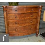 A Victorian mahogany bow fronted chest of two short and three long drawers flanked by projecting