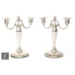 A pair of early 20th Century Finnish hallmarked silver two branch candelabra,