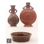 A collection of Chinese glazed wares, to include an iron-red glazed moonflask, height 24cm,