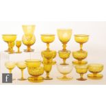 A selection of golden amber stemware, including a set of four sundae dishes,