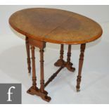 A late 19th century marquetry and line inlaid oval walnut Sutherland table on ring turned supports,