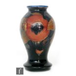 A Moorcroft vase of inverted baluster form decorated in the Pomegranate pattern with a band of open