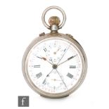 A continental silver crown wind pocket watch with twin subsidiary dials and stop watch facility
