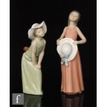 Two Lladro figures, 'Dreamer' model 5008 and 'Curious' model 5009, printed marks, height 25cm.