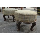 A pair of late 19th to early 20th Century mahogany foot stools of circular form,