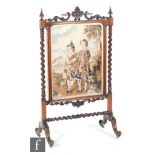 A Victorian large walnut framed fire screen,