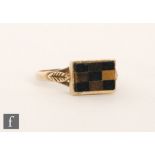 A 9ct hallmarked ring the rectangular head set with onyx and agate panels, ring size L.