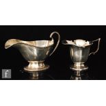 A hallmarked silver pedestal sauce boat with beaded borders and scroll handle Sheffield 1933,