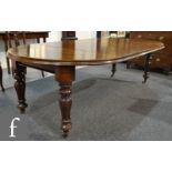 A Victorian mahogany extending mahogany dining table,