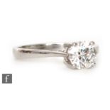An 18ct white gold diamond solitaire ring, brilliant cut claw set stones weight 1.