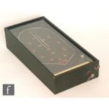 A mid 20th Century bagatelle type table top game The Wizard in simulated green case,