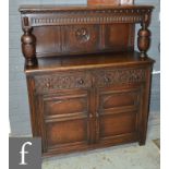 A small 17th Century style carved oak court cupboard,