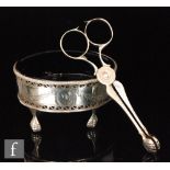 A pair of 18th Century hallmarked silver scissor action sugar nips with engraved decoration and