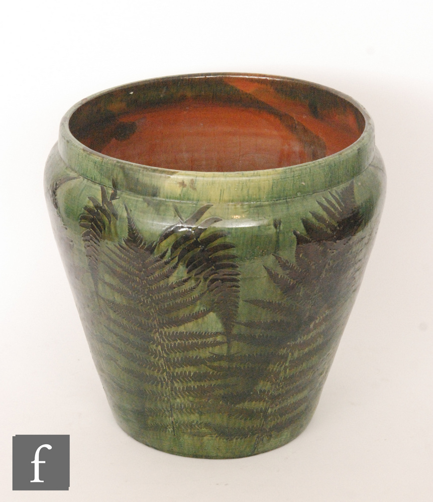 A large Ewenny Pottery jardiniere decorated with impressed fern leaves in brown,