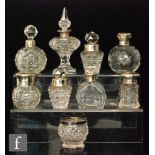 Nine assorted silver and clear cut glass dressing table bottles to include globular and other