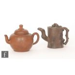 Two Chinese Yixing style teapots, the first of globular form with domed top and finial,