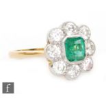 An 18ct emerald and diamond cluster ring,