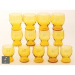 A set of nine golden amber ribbed and waisted tumblers, height 9.