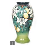 A large Moorcroft Pottery vase decorated in the Passion Fruit pattern designed by Rachel Bishop,