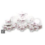 A 1930s Art Deco Shelley Eve shape teaset decorated in the Apple Blossom pattern comprising teapot,